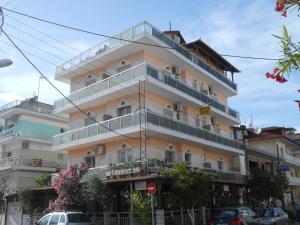 a building with balconies on the side of it at Hotel Germany in Paralia Katerinis