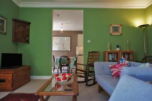 a living room with a couch and a table at 17 William Street in Helensburgh