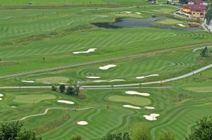 an aerial view of a golf course at Pension Da Capo in Sankt Georgen ob Murau