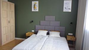 Łóżko lub łóżka w pokoju w obiekcie Apartament na Jeziornej