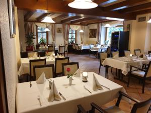 a dining room with white tables and chairs and tablesearcher at Hotel Kehrenkamp in Hagen