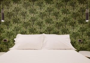 Postelja oz. postelje v sobi nastanitve Pompei Plaza