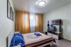 Кровать или кровати в номере Standard Brusnika Apartments Maryina Roshcha