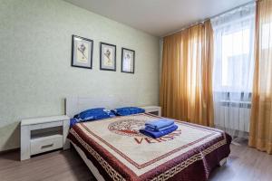  Кровать или кровати в номере Standard Brusnika Apartments Maryina Roshcha 
