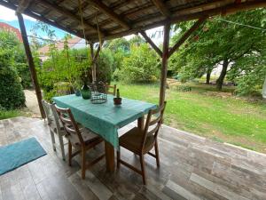 a blue table and chairs on a patio at Angel holiday appartman in Szentantalfa