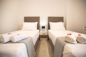 Ένα ή περισσότερα κρεβάτια σε δωμάτιο στο Raeti Apartments