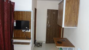 Kuchyň nebo kuchyňský kout v ubytování Anand P G hostel males only