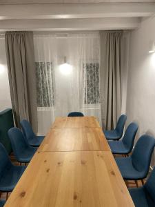 a conference room with a wooden table and chairs at Cabana The Lux in Beclean +15 photos