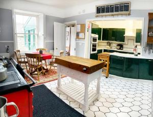 a kitchen with a table in the middle of it at House of Mark in Angus