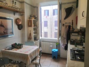 a kitchen with a table and a window at Piazza Bologna via Stamira 74 interno 12 Vita Felice in Rome