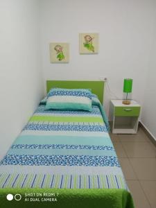 Postel nebo postele na pokoji v ubytování Apartamentos La Bodega