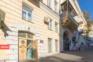 a building on a street with a store window at Central Area Apartments in Kyiv