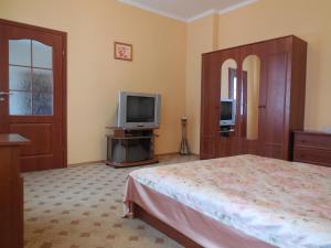 Ένα ή περισσότερα κρεβάτια σε δωμάτιο στο Ekaterininskaya Apartments