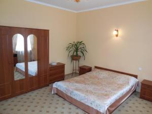 Ένα ή περισσότερα κρεβάτια σε δωμάτιο στο Ekaterininskaya Apartments
