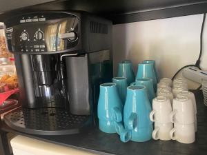 Coffee and tea making facilities at Villa Ghisolfa by Rhospitality it