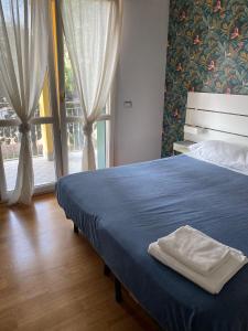 A bed or beds in a room at Villa Ghisolfa by Rhospitality it