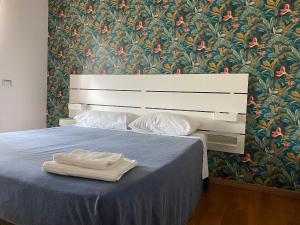 A bed or beds in a room at Villa Ghisolfa by Rhospitality it