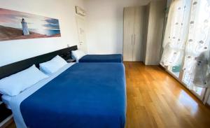 A bed or beds in a room at Villa Ghisolfa by Rhospitality it