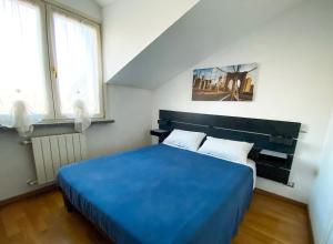 A bed or beds in a room at Villa Ghisolfa by Rhospitality it