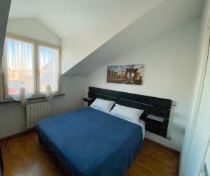 A bed or beds in a room at Villa Ghisolfa by Rhospitality it