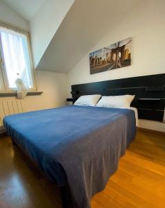 A bed or beds in a room at Villa Ghisolfa by Rhospitality it