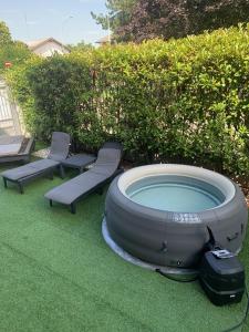A garden outside Villa Ghisolfa by Rhospitality it