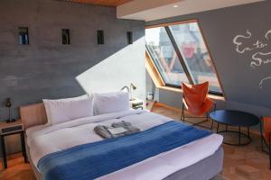 Rúm í herbergi á Asakusa Kokono Club Hotel