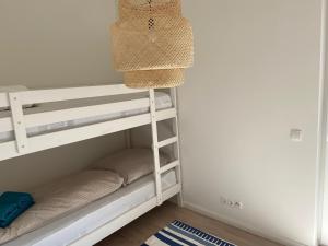 Katil atau katil-katil dalam bilik di Wohnen am Südstrand - Ferienwohnung 0 6