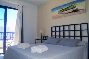 A bed or beds in a room at Casa Tacande