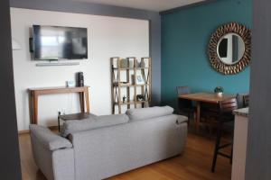 a living room with a couch and a table at Downtown Mexico City, full apartment in Mexico City