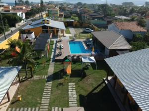an aerial view of a house with a swimming pool at Pousada X in Saquarema