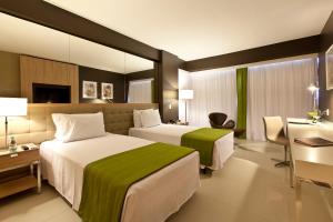 Cama ou camas em um quarto em eSuites Savassi Toscanini mais 37 fotos