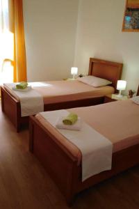 A bed or beds in a room at Apartments with a parking space Razanj, Rogoznica - 17328