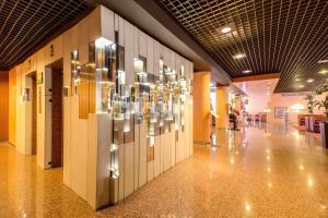 a hallway with a chandelier in a building at Hotel Galileo in Milan