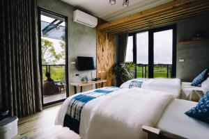 Llit o llits en una habitació de 似禾苑民宿 Siheyuan Homestay