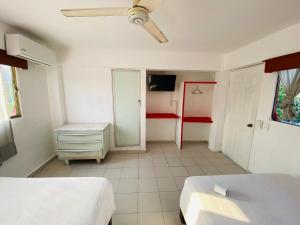 מיטה או מיטות בחדר ב-Hotel Maria Bonita Acapulco