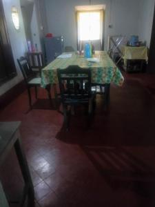 a dining room with a table and chairs at Green Fields in Colovale