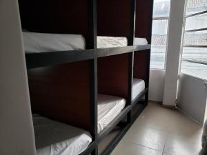 A bed or beds in a room at Aima Ibagué