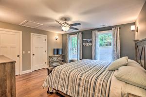a bedroom with a bed and a ceiling fan at Massanutten Resort Retreat with Hot Tub and Game Room! in Massanutten