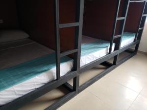 A bed or beds in a room at Aima Ibagué