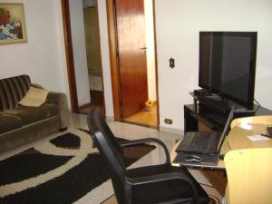 โทรทัศน์และ/หรือระบบความบันเทิงของ Apartamento Guarulhos