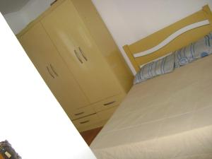 A bed or beds in a room at Apartamento Guarulhos