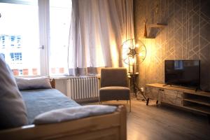 TV a/nebo společenská místnost v ubytování Le Rosset