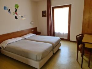 Letto o letti in una camera di Hotel Daniela
