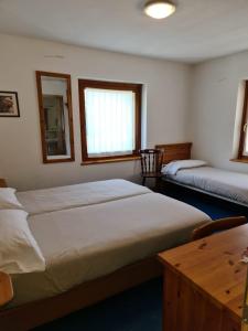 Letto o letti in una camera di Hotel Daniela