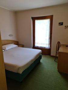Letto o letti in una camera di Hotel Daniela