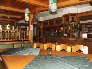 a dining room with a table and chairs at Hotel Haus Irsfeld in Waxweiler