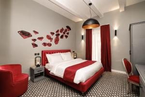 Postel nebo postele na pokoji v ubytování Casa Reale Boutique Hotel