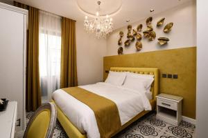 Postel nebo postele na pokoji v ubytování Casa Reale Boutique Hotel