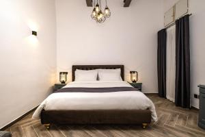 Postel nebo postele na pokoji v ubytování Casa Reale Boutique Hotel